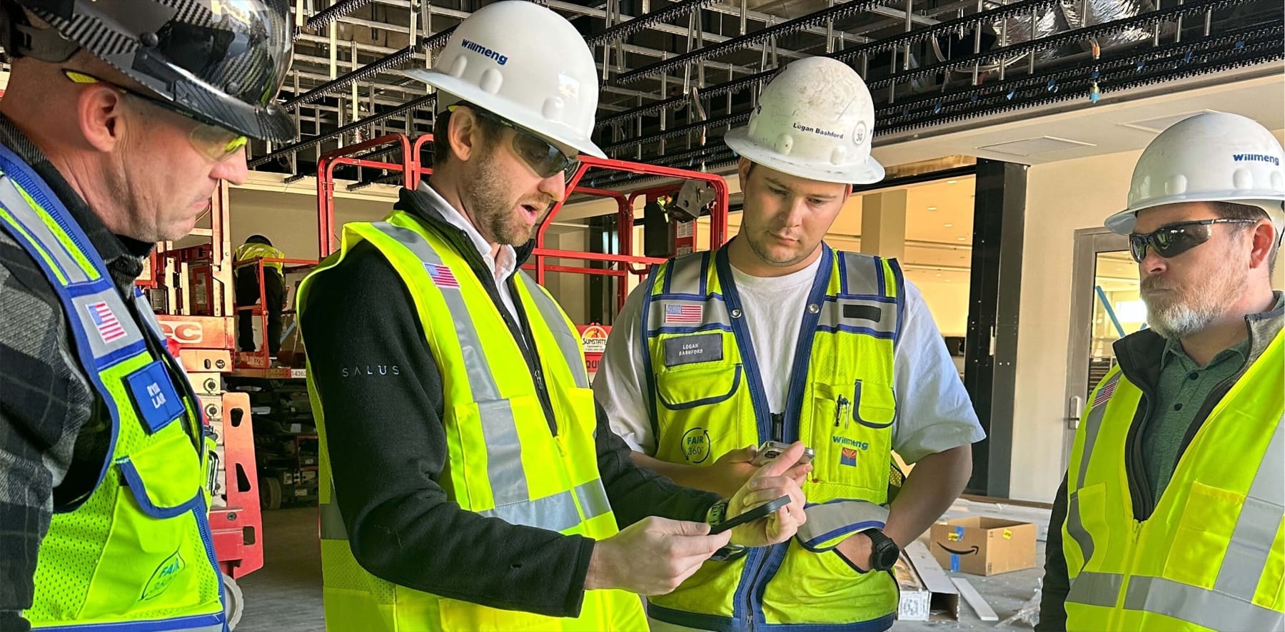 Construction crews reviewing site access requirements before starting work